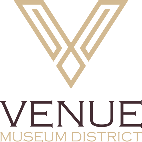 The logo for the Venue Museum District features a V-shaped design.